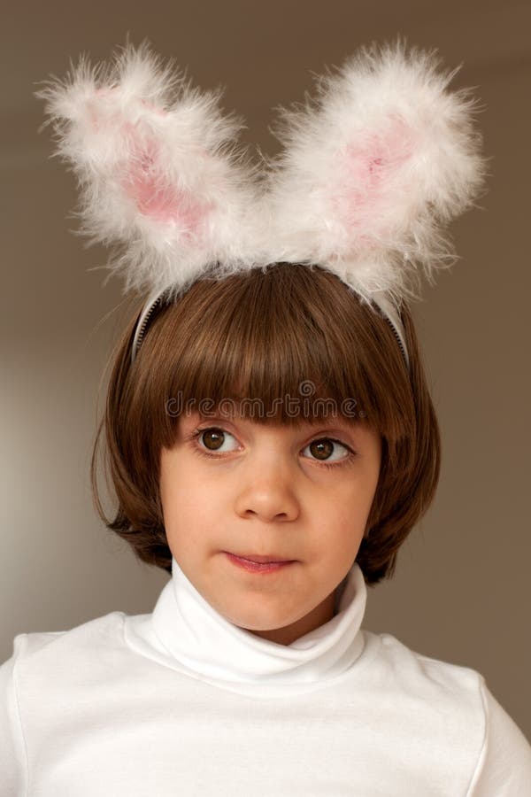 Pretty little girl in bunny ears