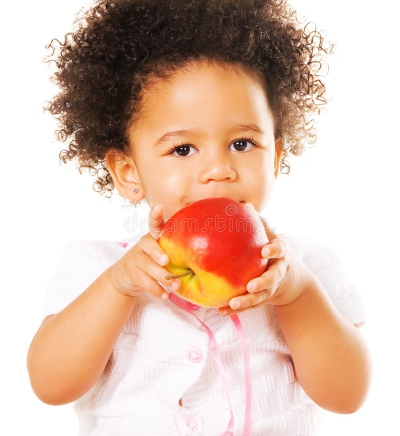 Pretty little girl holding an apple