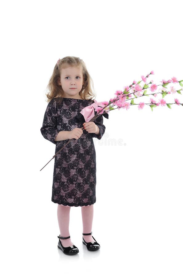 Pretty little girl in party dress with flowers