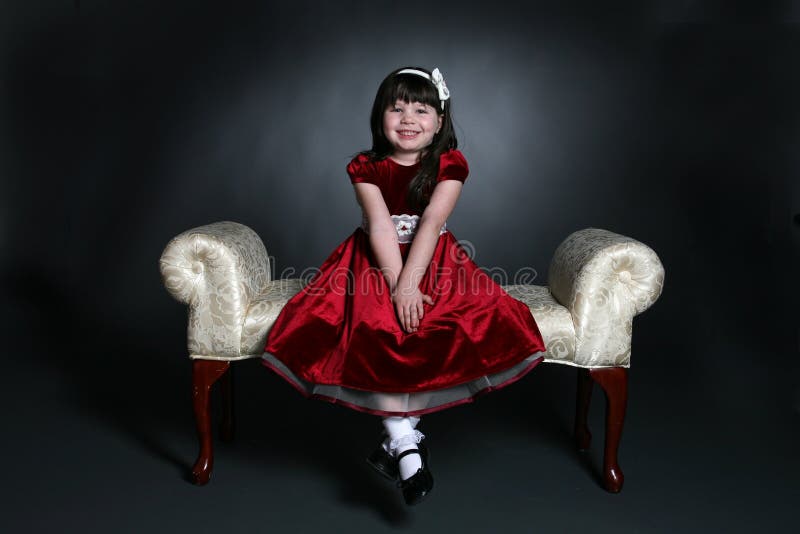 Pretty little girl in red holiday dress