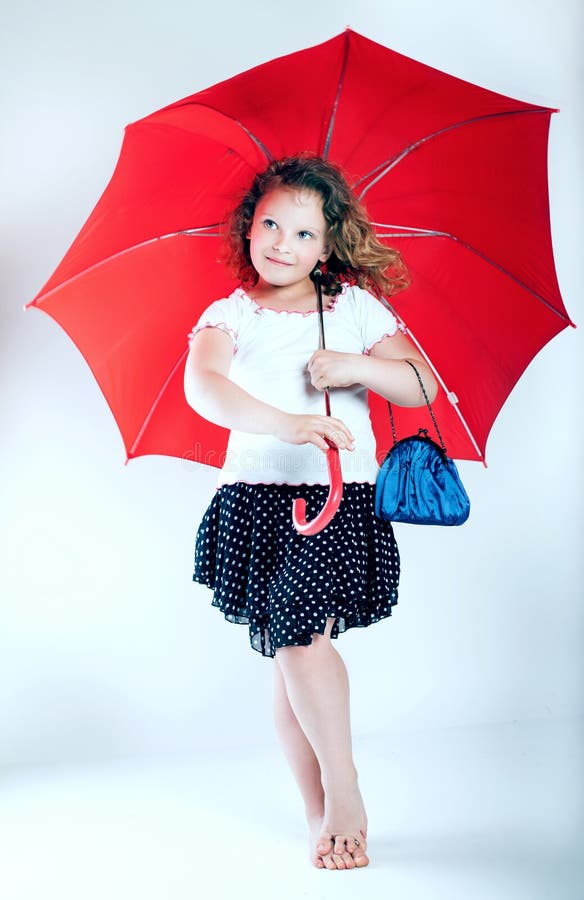 Pretty Little Girl with Umbrella. Stock Photo Image of happiness