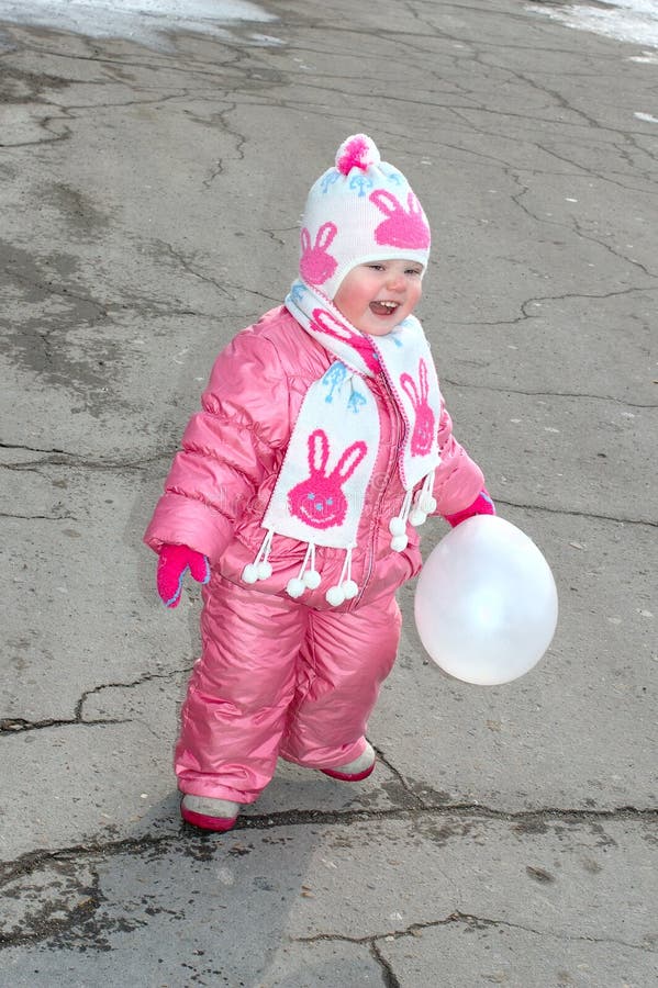 Pretty little girl with white balloon.
