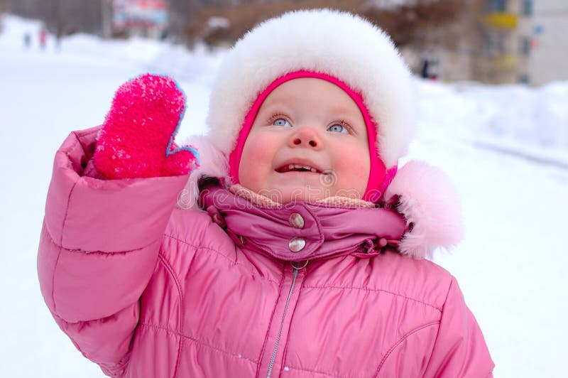 Pretty little girl in winter outerwear.