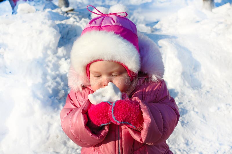 Pretty little girl in winter outerwear.