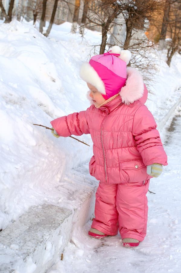 Pretty little girl in winter outerwear.