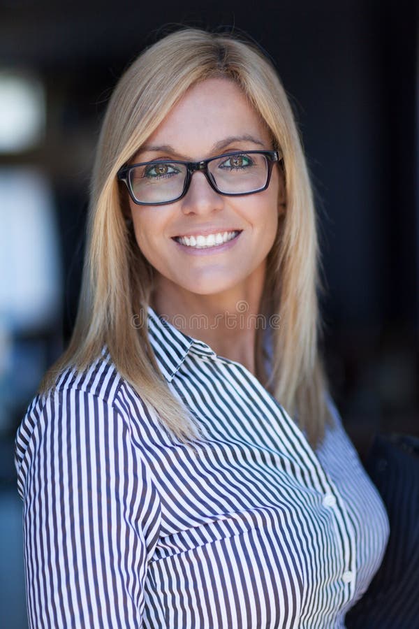 Pretty Mature Businesswoman Smiling At The Camera She Wears Glasses