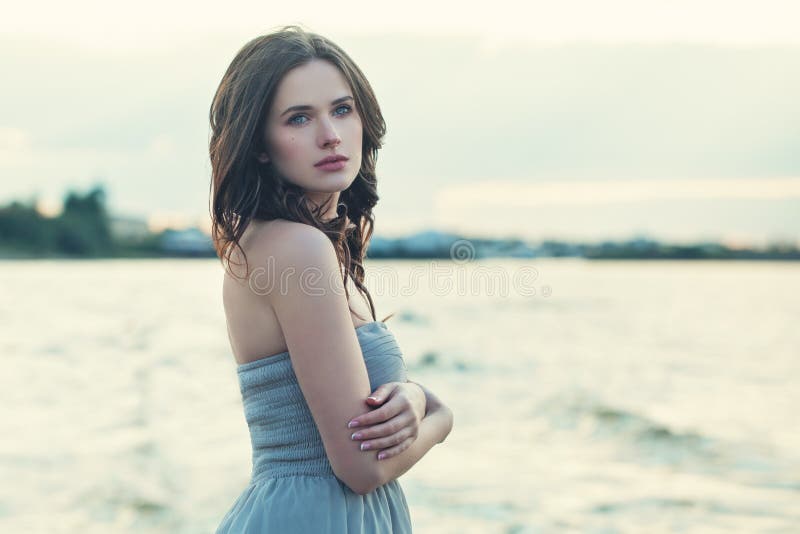 Pretty model girl on ocean background, romantic portrait stock photography Pretty model girl on ocean background, romantic portrait stock photography