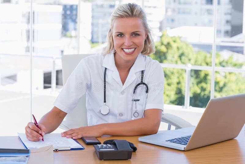 Pretty Nurse Working in Her Office Stock Image Image of notepad