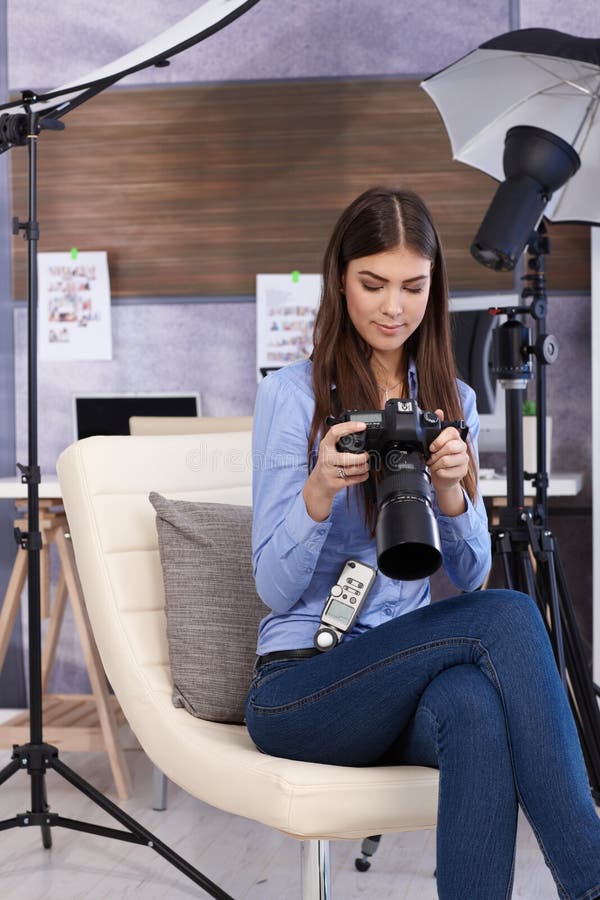 Pretty photographer woman with camera