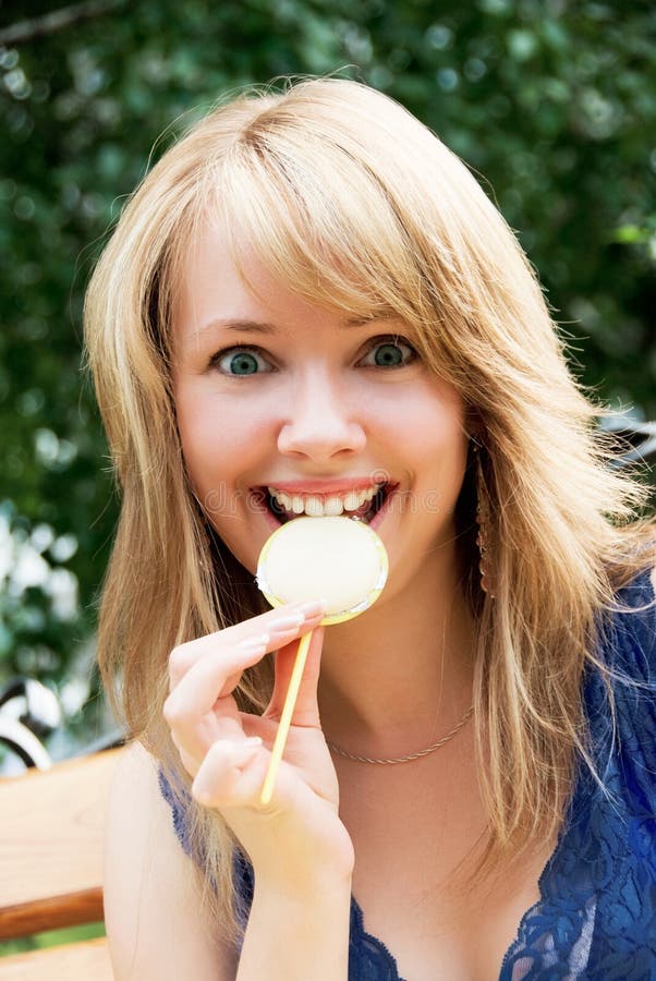 Pretty Playful Girl Eating A Candy Picture. Image 5963248