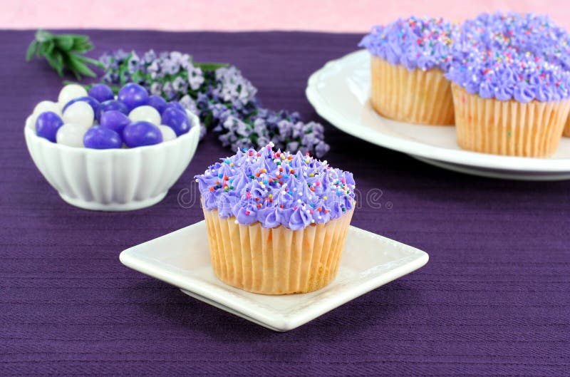 Pretty Purple Cupcakes and Jelly Beans for Easter Stock Photo Image