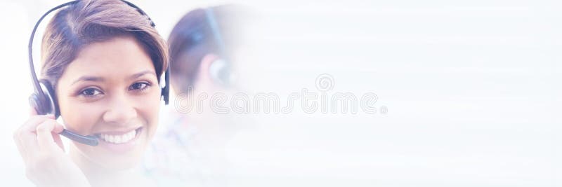 Pretty smiling businesswoman working in a call centre