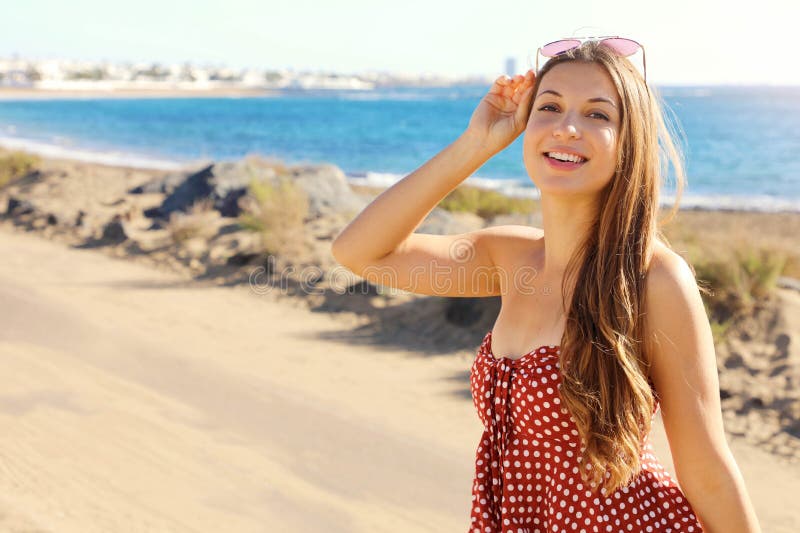 Pretty smiling fashion girl looking at camera outdoor. Happy laughing lovely young tourist woman looking excited at camera royalty free stock photo Pretty smiling fashion girl looking at camera outdoor. Happy laughing lovely young tourist woman looking excited at camera royalty free stock photo