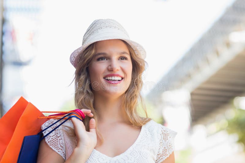 A pretty smiling woman looking away