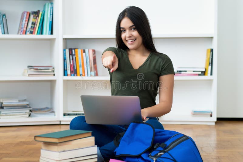 Pretty spanish computer science student with laptop stock photos