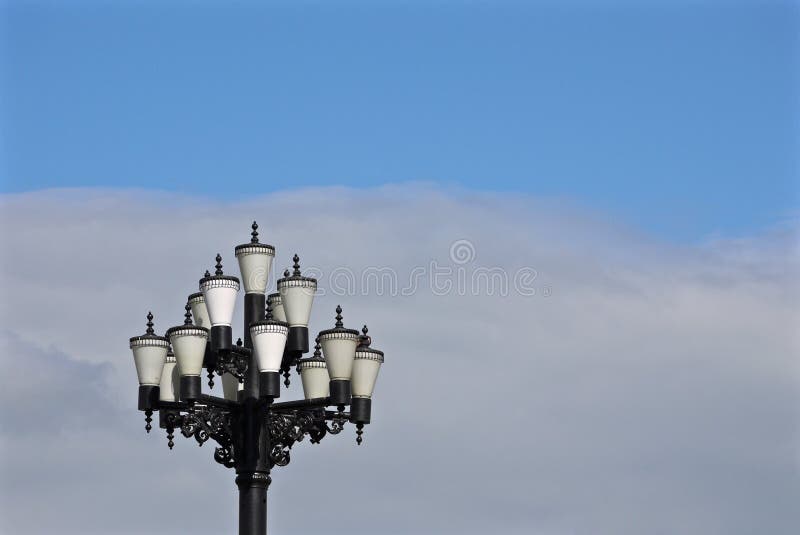 Pretty Street lamp with many glass covers on background of blue sky stock images Pretty Street lamp with many glass covers on background of blue sky stock images