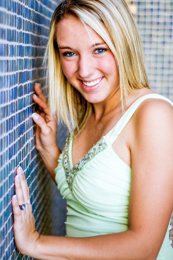 Pretty teen girl with blonde hair stock photo
