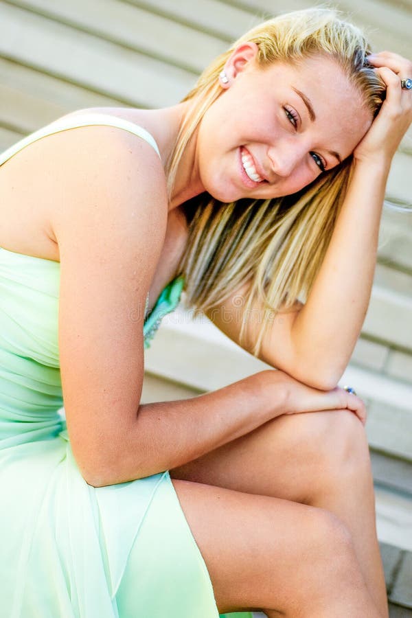 Pretty teen girl with blonde hair royalty free stock photography