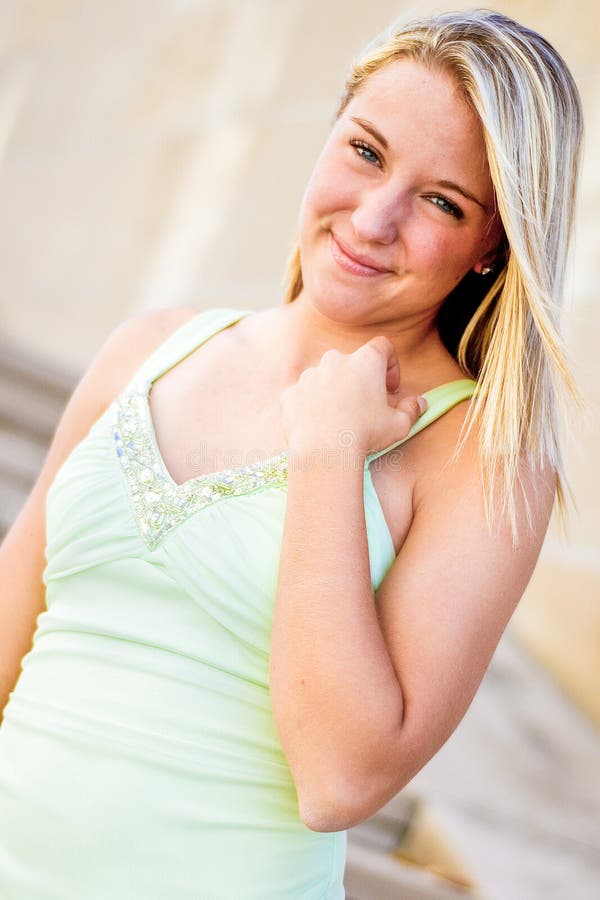 Pretty teen girl with blonde hair royalty free stock photos