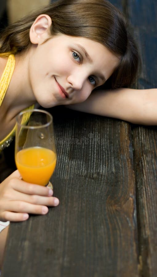 Pretty teen girl with juice