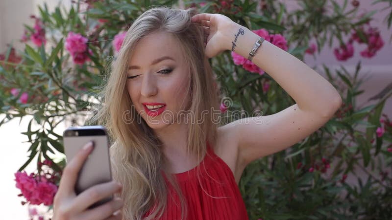 Pretty Teen Girl Uses Her Phone Outside, She Poses For A Selfie