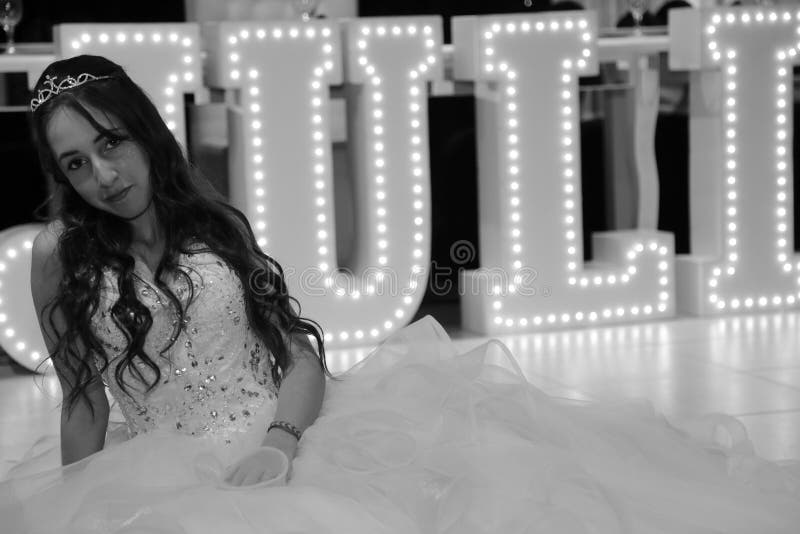Pretty teen quinceanera birthday girl celebrating in princess dress pink party, special celebration of girl becoming woman. royalty free stock photography Pretty teen quinceanera birthday girl celebrating in princess dress pink party, special celebration of girl becoming woman. royalty free stock photography