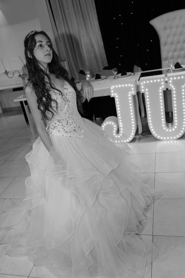 Pretty teen quinceanera birthday girl celebrating in princess dress pink party, special celebration of girl becoming woman. stock photography Pretty teen quinceanera birthday girl celebrating in princess dress pink party, special celebration of girl becoming woman. stock photography