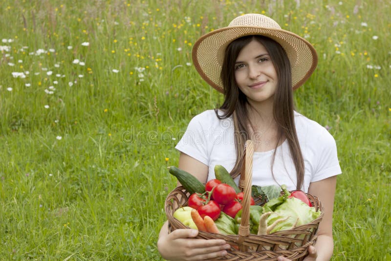 Pretty Teenage Girl Holding a Basket of Vegetables Stock Photo - Image ...