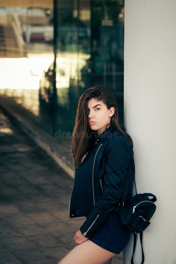 Pretty teenage girl posing on the street royalty free stock image Pretty teenage girl posing on the street royalty free stock image