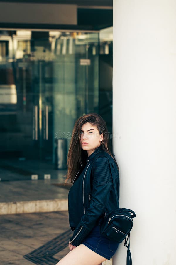 Pretty teenage girl posing on the street royalty free stock photo Pretty teenage girl posing on the street royalty free stock photo