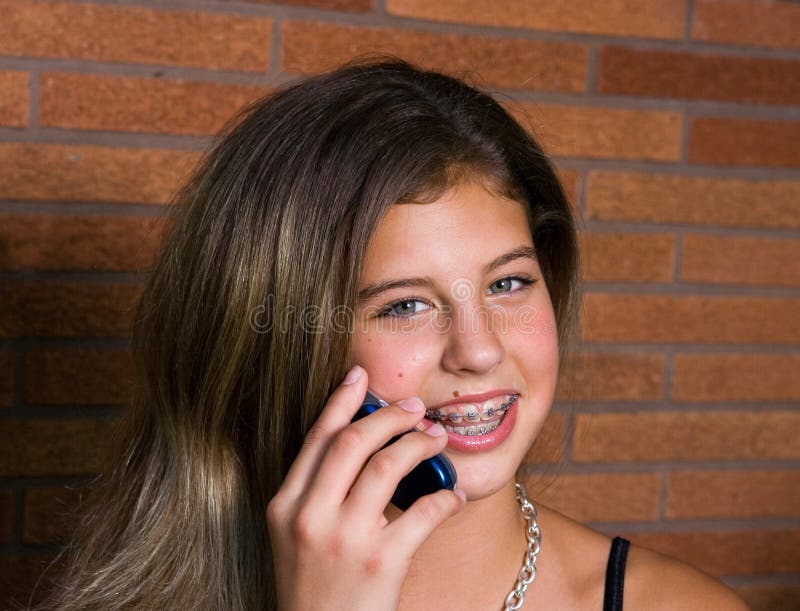 Pretty teenage girl talking on the phone