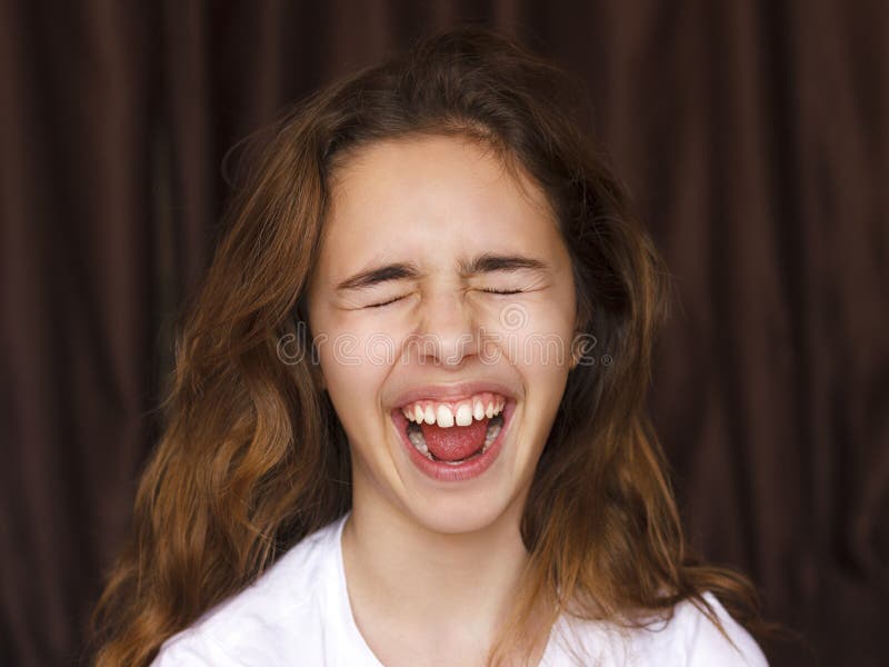 Pretty Teenager Girl with Long Hair Makes Very Funny Face and Laughing with  Closed Eyes Stock Photo - Image of joyful, happiness: 139501844