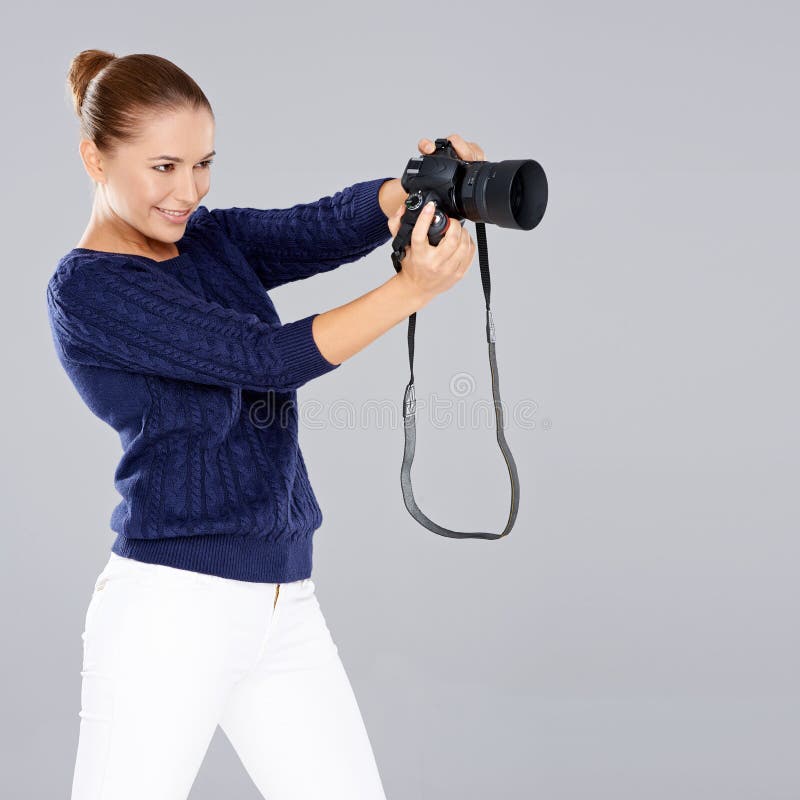 Pretty vivacious young female phoptographer royalty free stock photography Pretty vivacious young female phoptographer royalty free stock photography