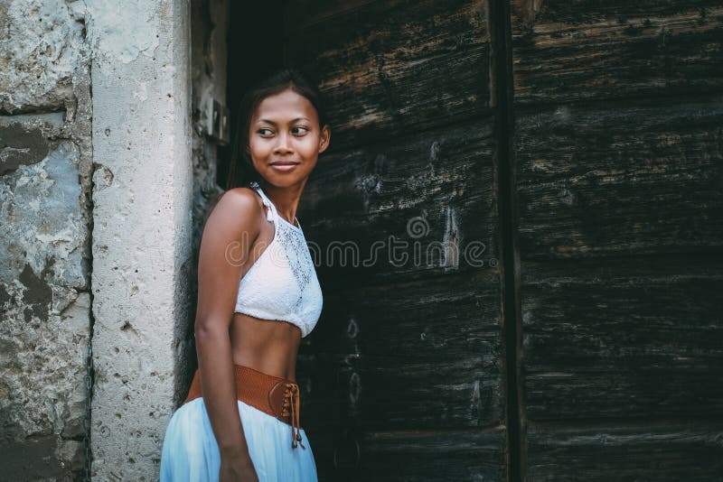Download Pretty Woman In Ethnic Mediterranean Traditional Costume Entering The Wooden Barn Doors Stock Image - Image of costume, female: 102927503