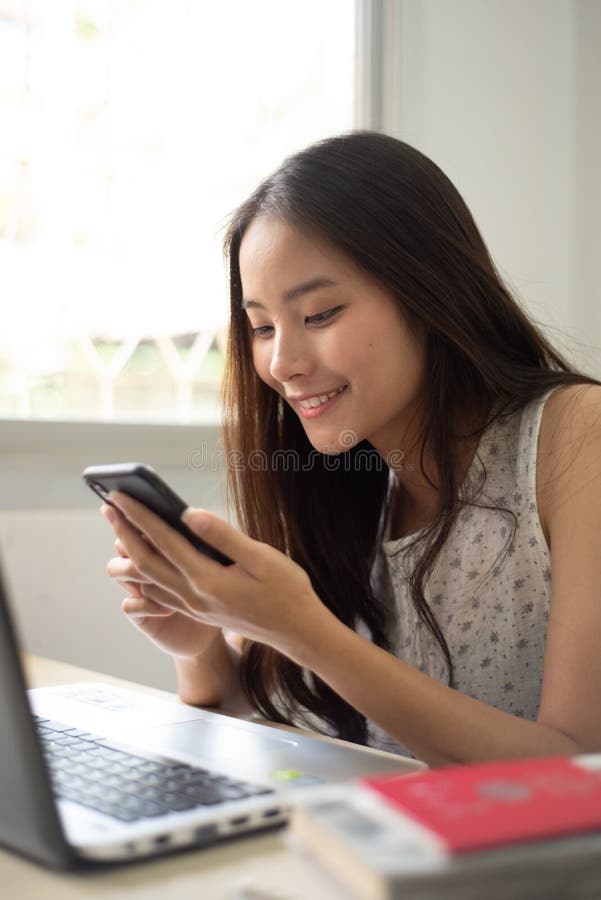 Pretty woman shopping online with her mobile stock photos Pretty woman shopping online with her mobile stock photos