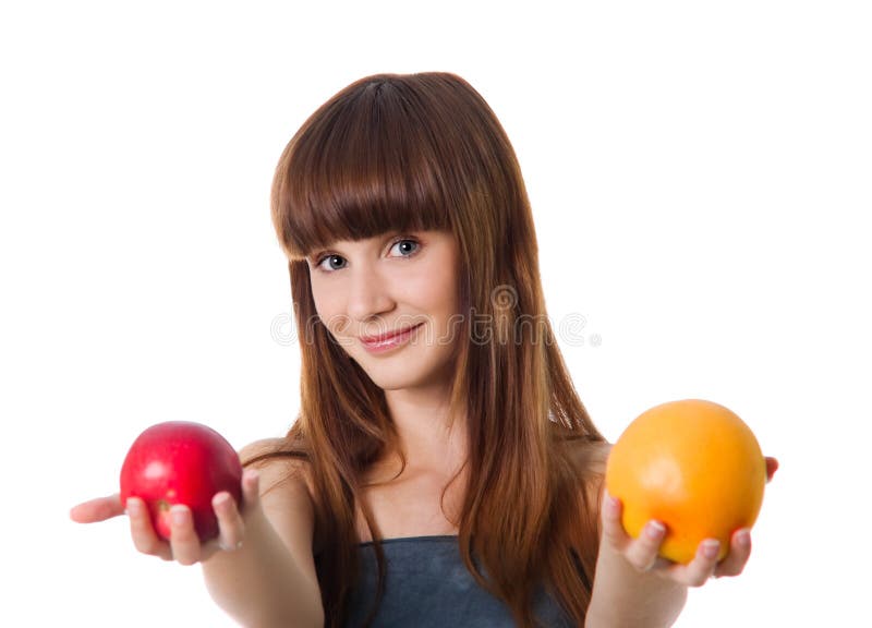 Pretty woman hold apple and orange