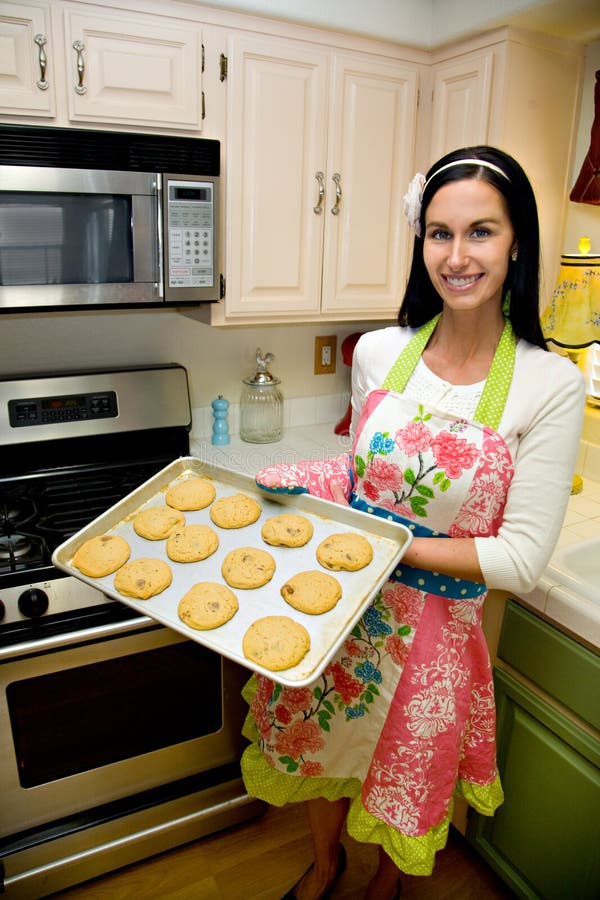 Pretty Woman In Kitchen Baking Cookies Stock Images Image 13740804