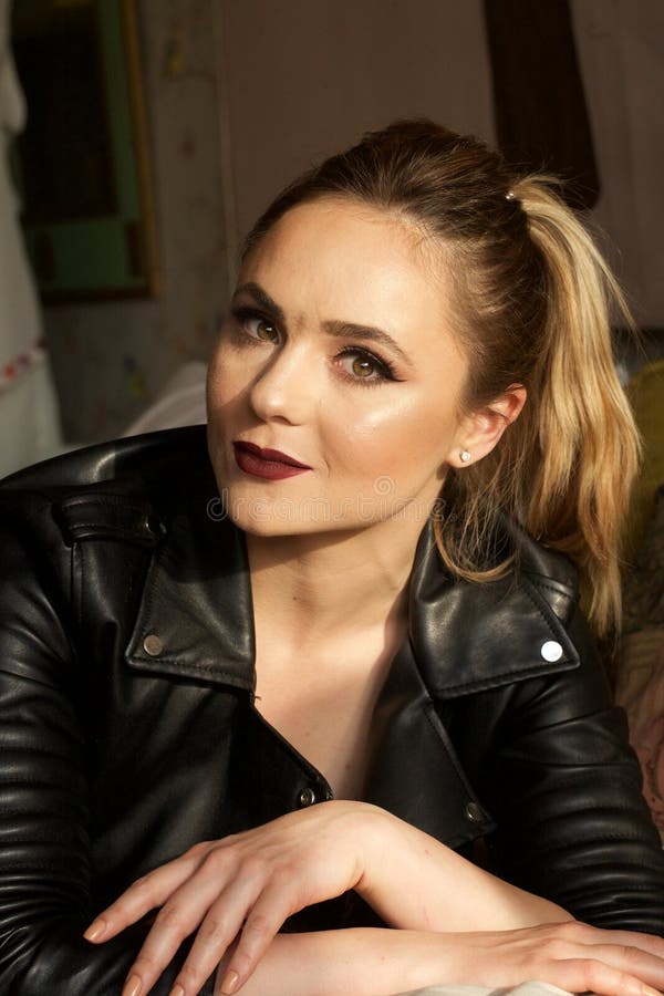 Pretty woman in leather jacket