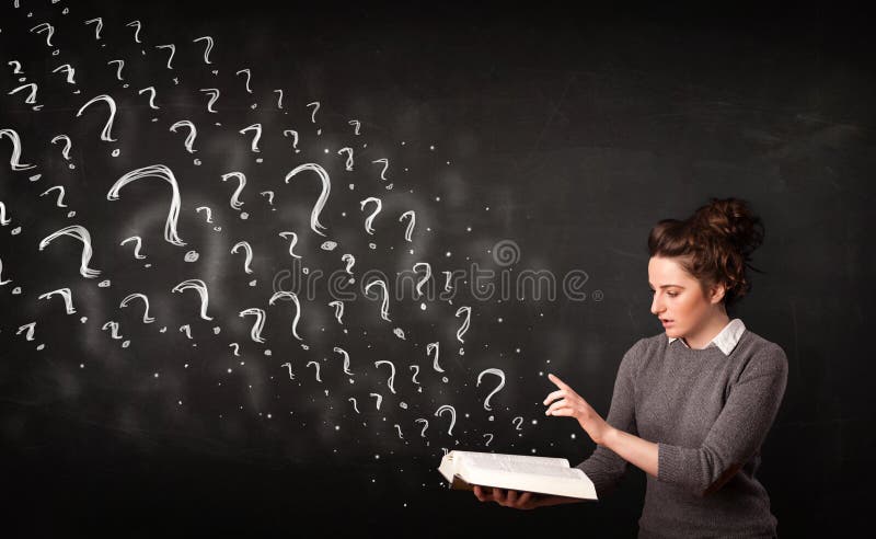 Pretty woman reading a book with question marks coming out from stock photography