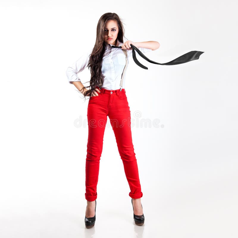Pretty Woman in Red Pants and Flying Cravat in Studio Stock Photo