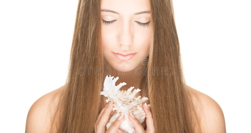 Pretty woman with seashell isolated on white.