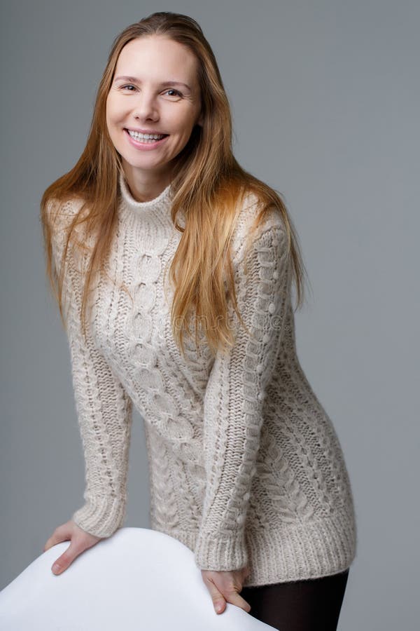 Pretty woman standing in jacket royalty free stock images