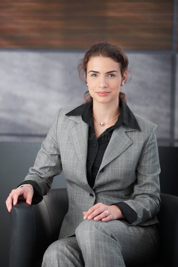 Pretty woman waiting for job interview in hall stock photo Pretty woman waiting for job interview in hall stock photo
