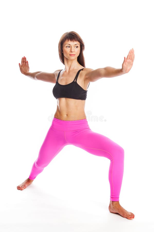 Pretty Woman in Yoga Pose - Warrior Position. royalty free stock image Pretty Woman in Yoga Pose - Warrior Position. royalty free stock image