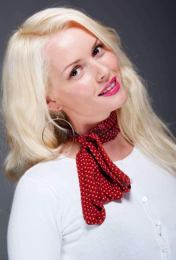 Pretty young blonde female with red scarf