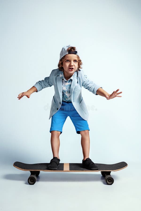 Pretty Young Boy on Skateboard in Casual Clothes on White Studio ...