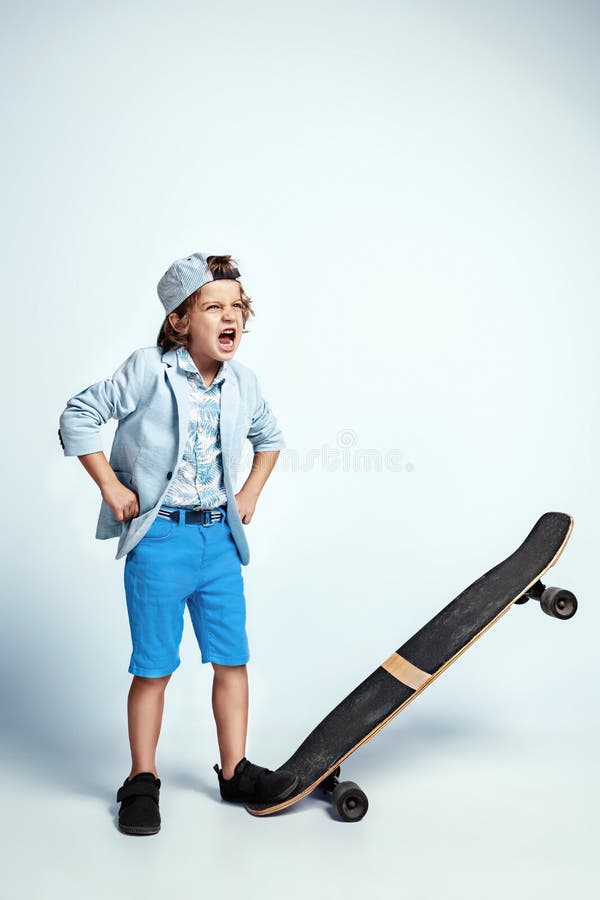 Pretty Young Boy on Skateboard in Casual Clothes on White Studio ...