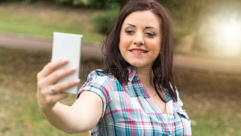 Pretty Young Brunette Taking A Selfie Outdoors Light Effect Stock Image Image Of Female 