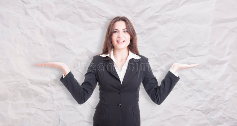 Pretty young female manager with palms up stock photos Pretty young female manager with palms up stock photos