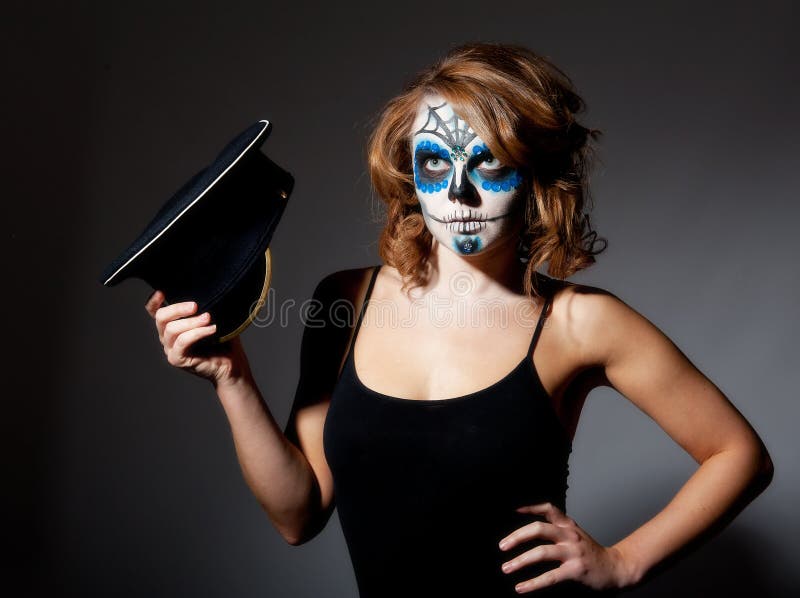 Pretty young female in sugar skull make up